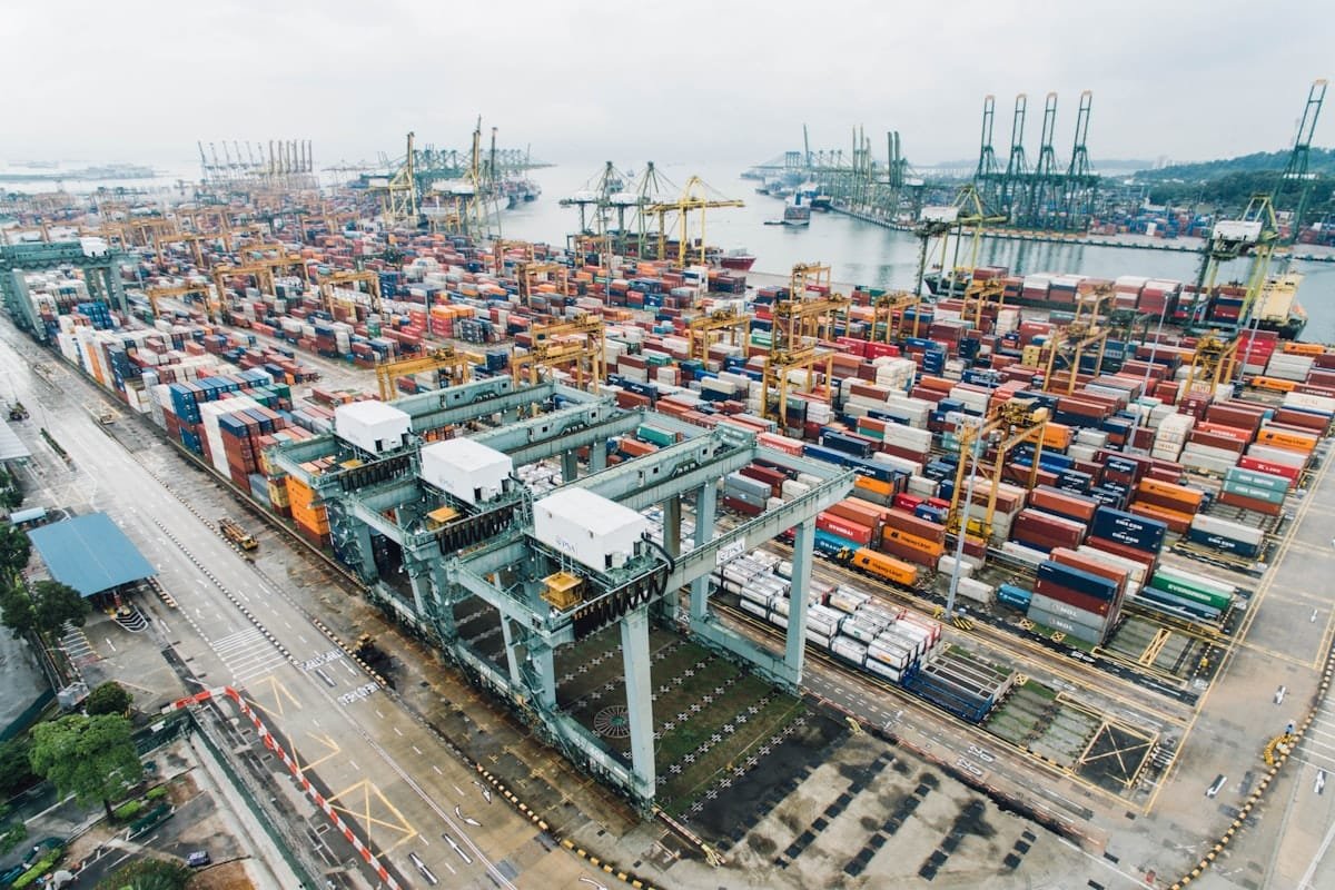 Container port in Southeast Asia, cranes working the waterfront